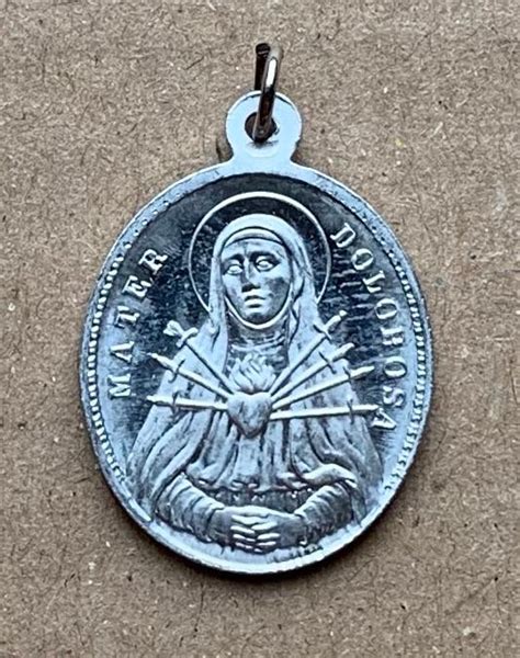 Symbol Panny s knihou a perom