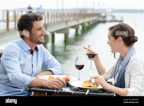 Couple having a romantic dinner by the sea