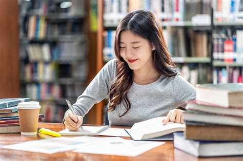 Woman studying and reading books